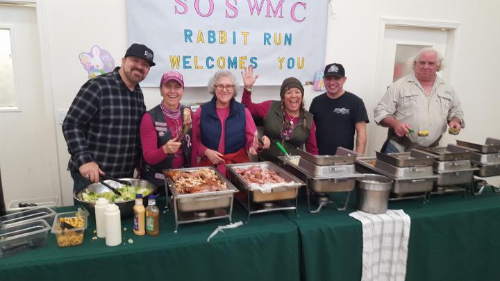 Our wonderful volunteers serving up turkey ham, sweet potatoes, green beans and candied yams!